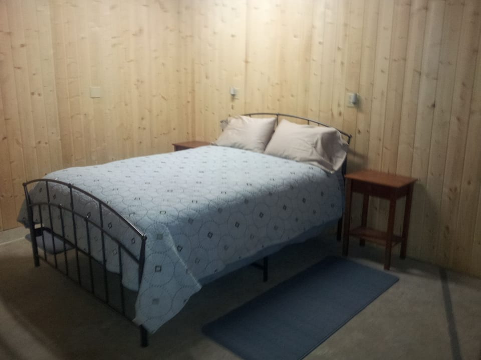 Bed in daylight basement, semi-private corner