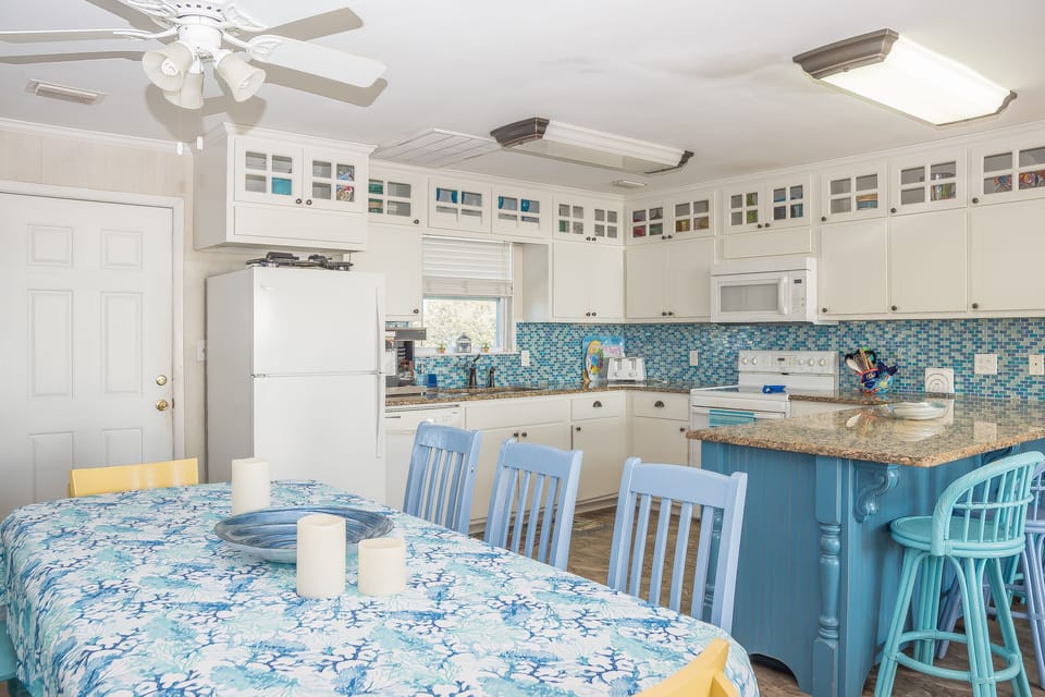  Dining for 8 plus 4 more at the bar and additional tables and chairs on deck