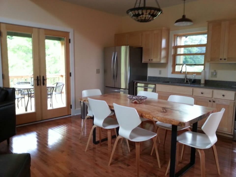 The galley kitchen is well stocked and features dining at custom dining table.