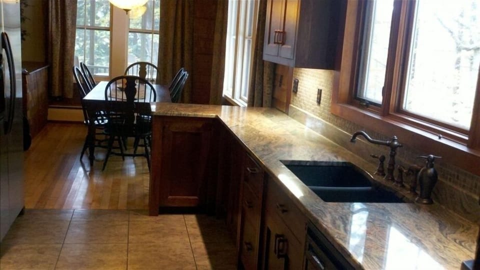 Granite Kitchen with plenty of storage. Open to Dining. 2 seats at counter.