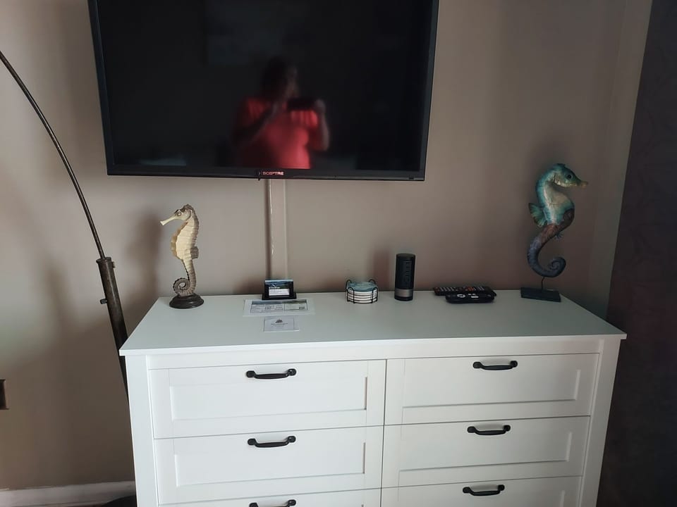 Cable tv with free HBO.  Charging tower on dresser