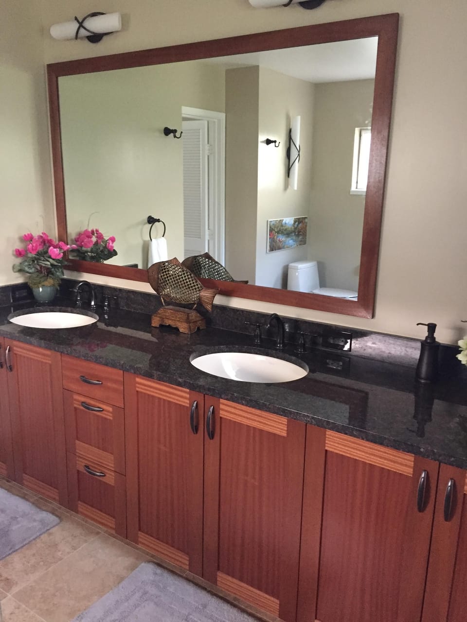 Large bathroom granite countertop with double vanity.