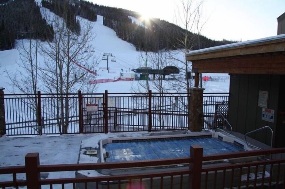 14 Ft Hot Tub is next to our condo.  Tubing Hill is behind the Aspen trees!