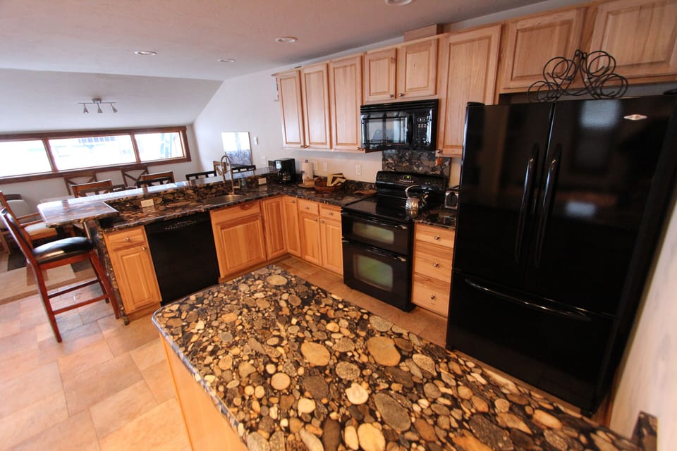 River Stone 3cm Granite countertops, double oven, Hickory cabinets. 