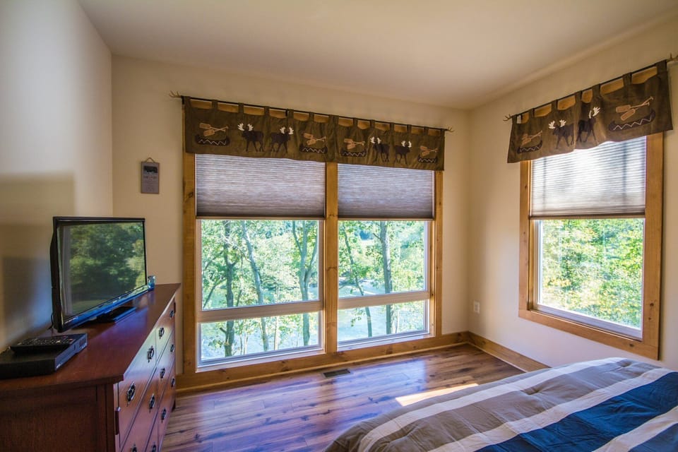 View the river while watching TV from your bed