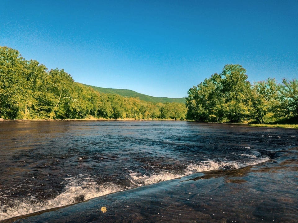 Rapids and river right next to house (this shot taken with a drone a few feet above the water)