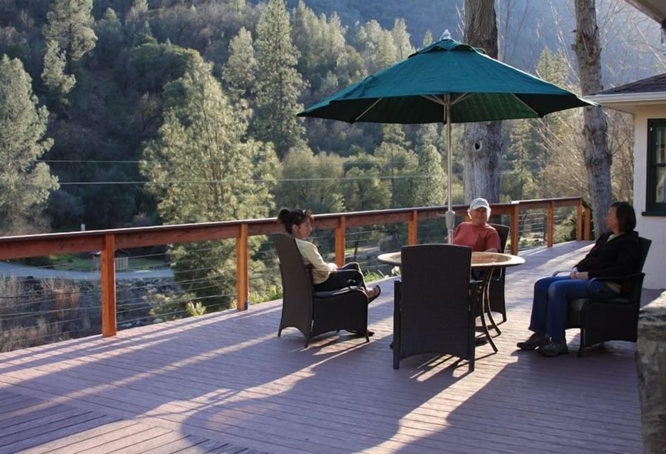 Enjoy gorgeous mountain and river views while visiting or dining on the deck