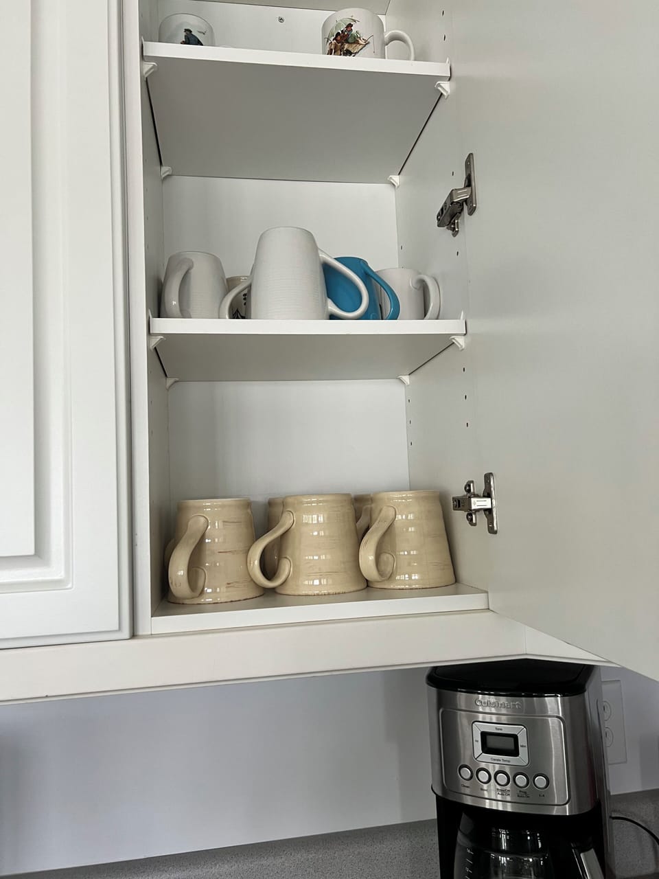 Kitchen has lots of coffee mugs