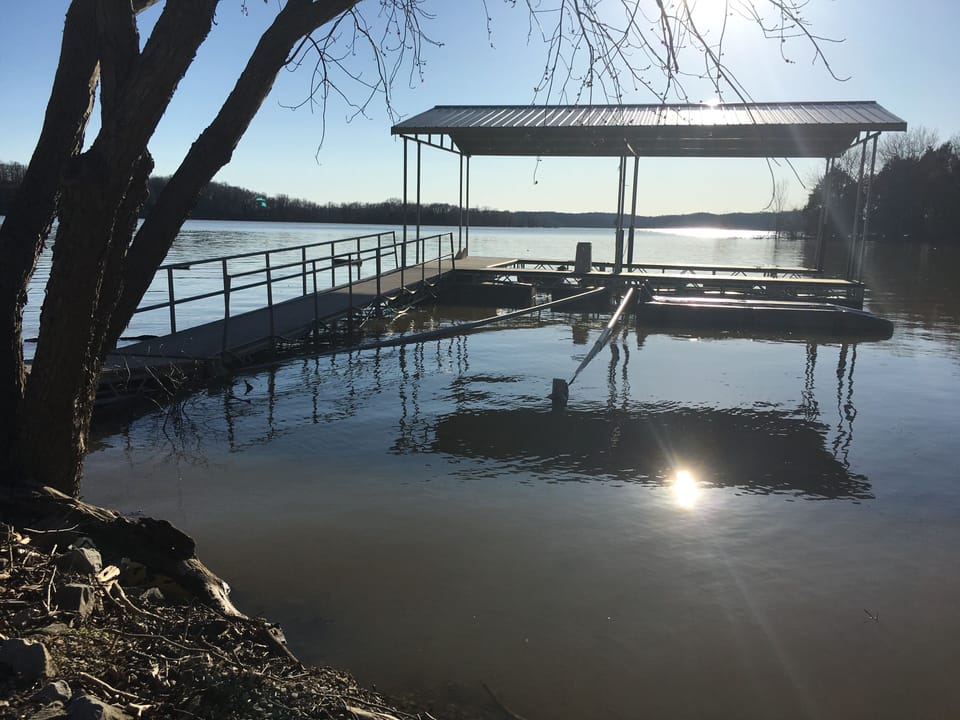 Covered dock with two jet ski platforms. 