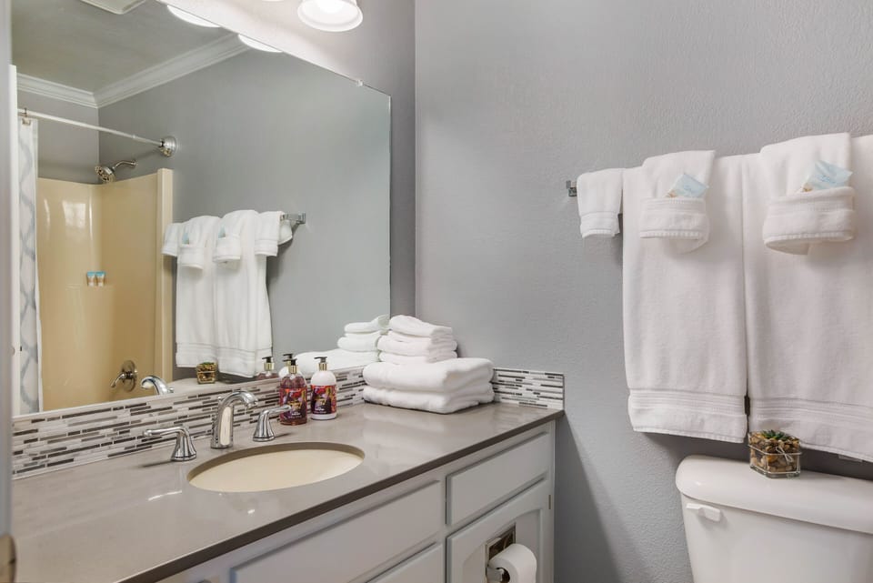 This bathroom is shared by bedrooms #2 and #3. 