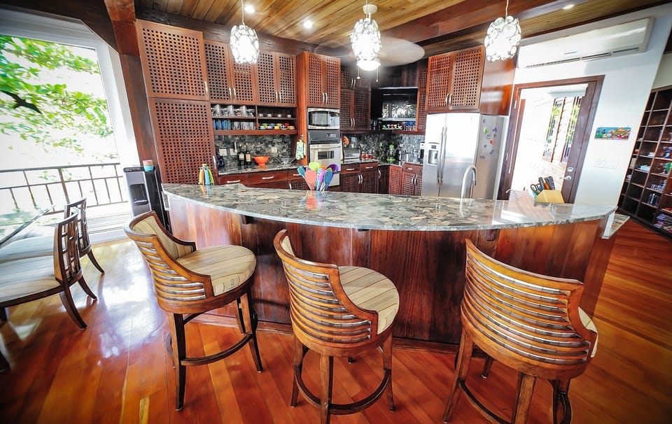 Dining room with wrap around deck facing beach