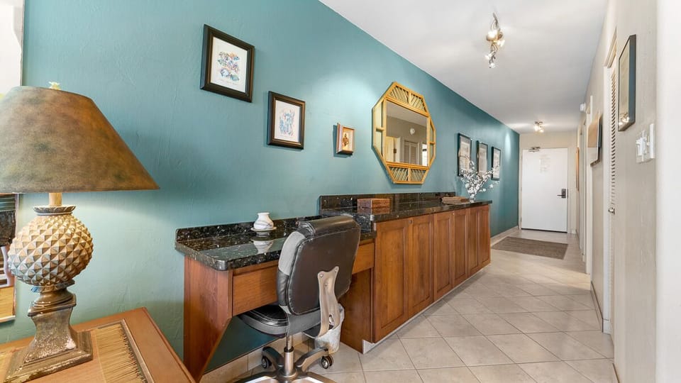 Entry hall with large built in maple/granite buffet and functional desk area.