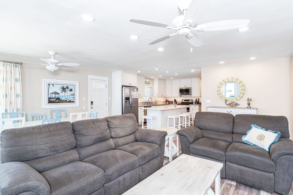 The main living, dining, and kitchen area open up to each other for easy, social gatherings.
                