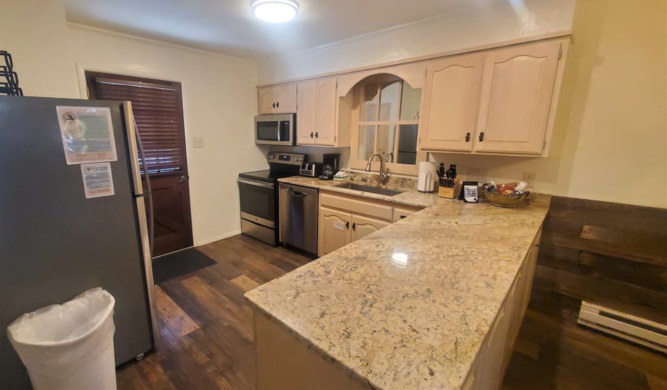 Your fully-equipped kitchen features granite counters, stainless appliances, and everything you need to prepare meals during your stay.