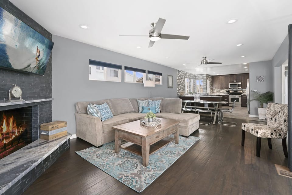 Modern and cheery open floor plan welcomes guests to the upper, ocean view level of this two-story main house. Ceiling fans throughout.
                