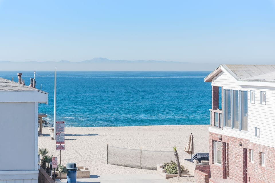 40th Street beach views are front and center from multiple vantage points in the stylishly modern 2-story front main house.
                