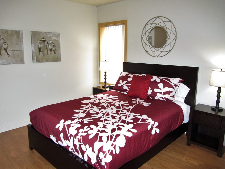 Queen bedroom with flat screen TV (out of shot)