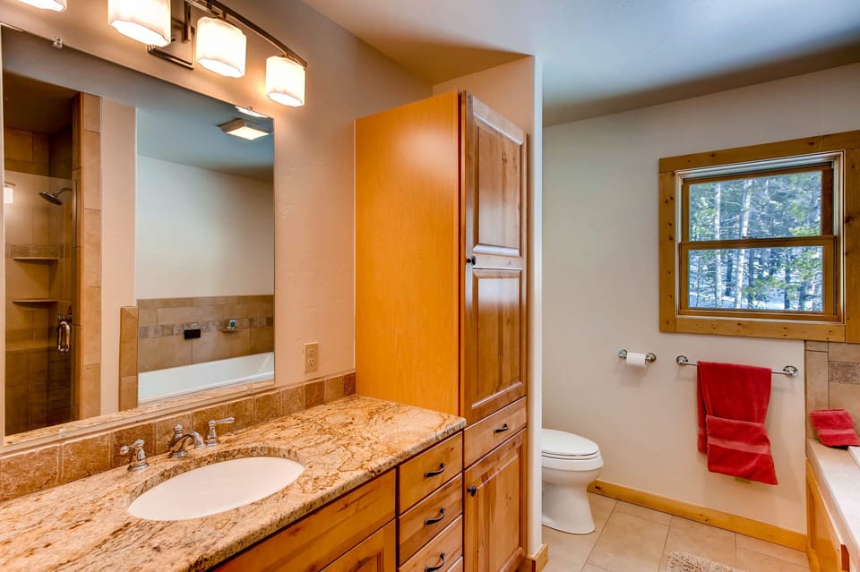 The master bath has a double vanity, a jetted vibra sound tub, and a walk-in shower. it can be completely private or opened for entry from the left where there is an additional sleeper sofa.