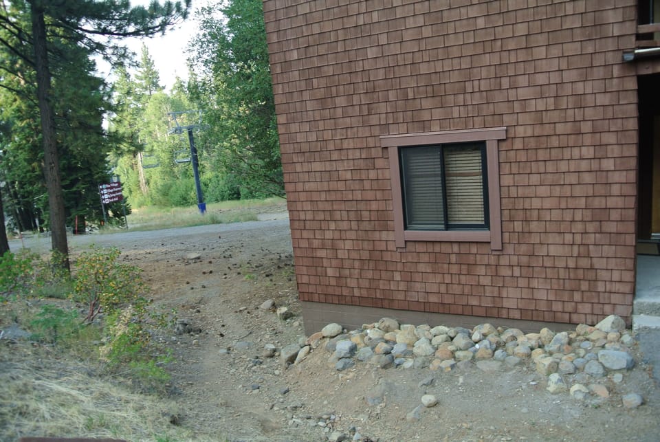 Condo Exterior & Trail to Slope-Summertime Picture