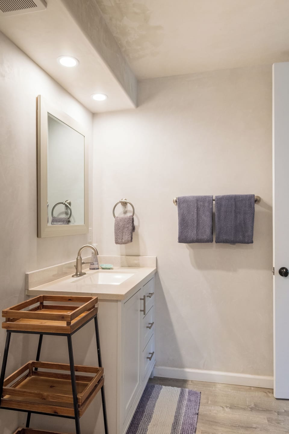 Private full bathroom with fresh towels and body wash.