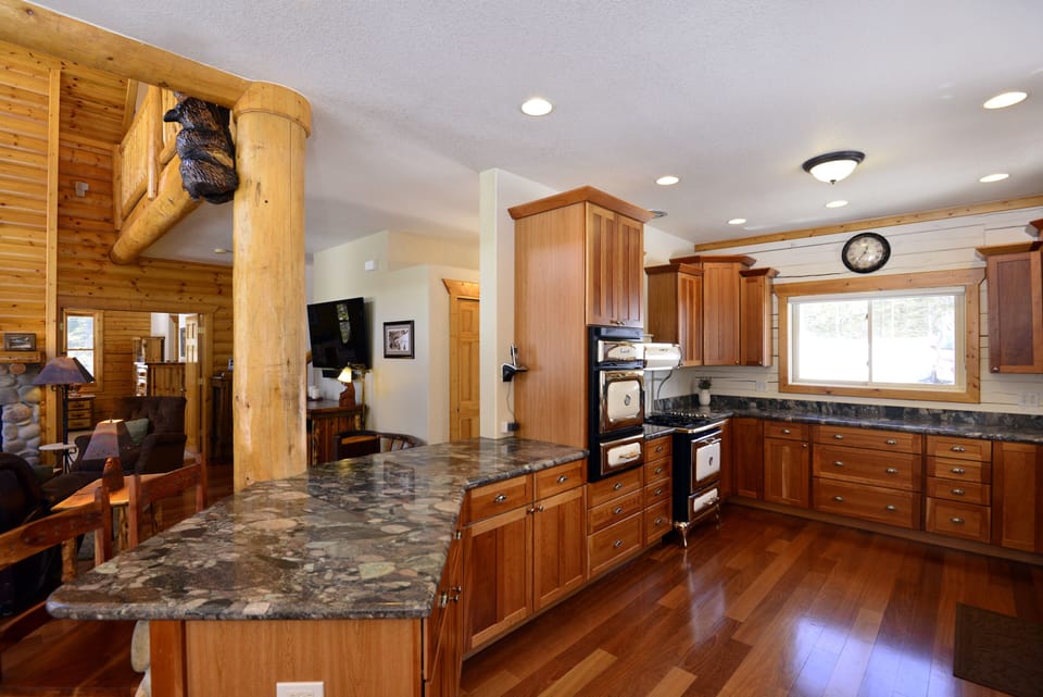 The heart of the home kitchen w/ bar seating is open to the great & dining rooms