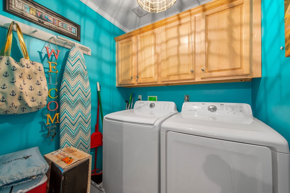 Laundry room in condo unit