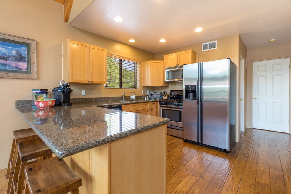 Kitchen w/ breakfast bar.