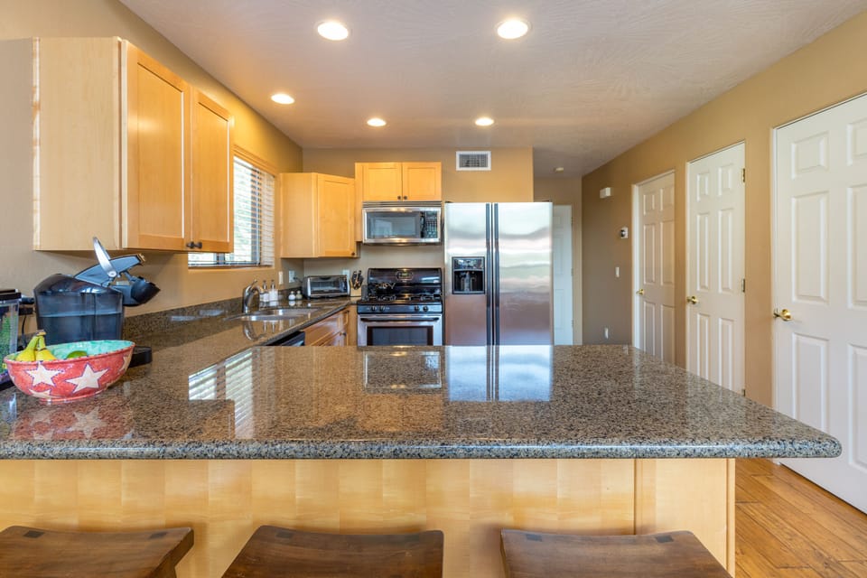 Kitchen w/ breakfast bar.
