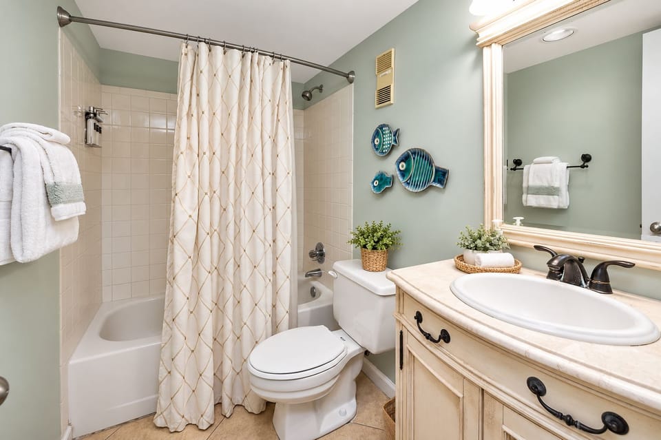 Guest bathroom with a convenient tub and shower combination