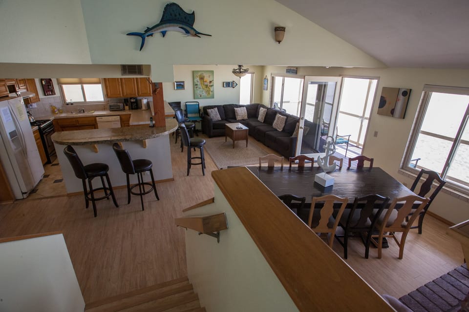 Main Room with door and windows to the sea