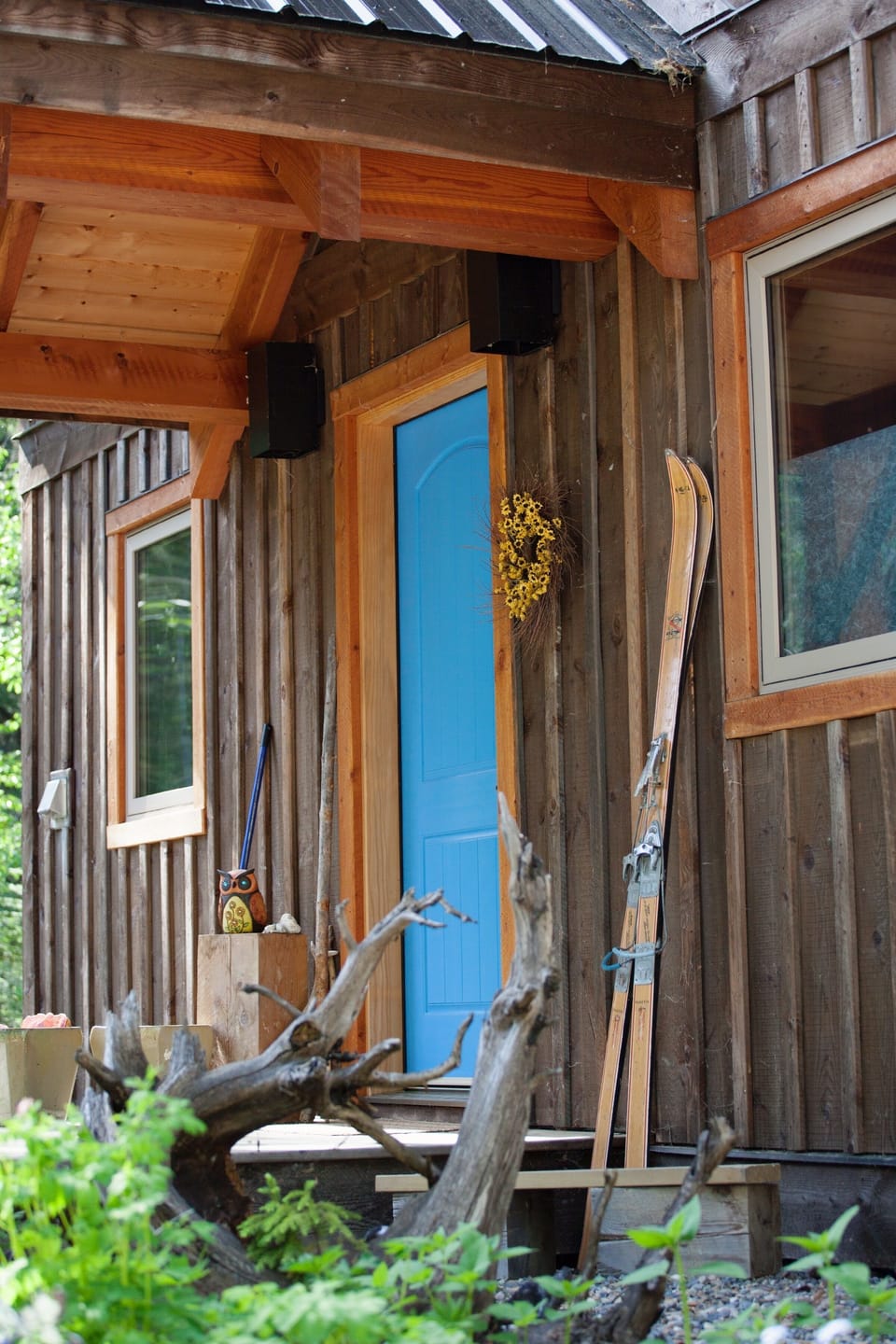 Covered entryway is steps away from the double carport.