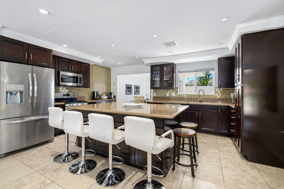 Kitchen, Island, Stainless Steel appliances, formal dining room in background
