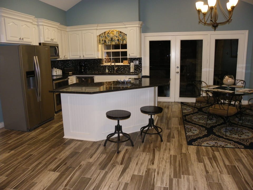 BRAND New Upstairs Kitchen with granite, custom cabinets and new appliances.