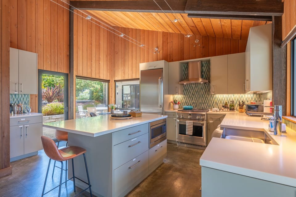 Kitchen area provides ample seating to watch the hummingbirds in the courtyard