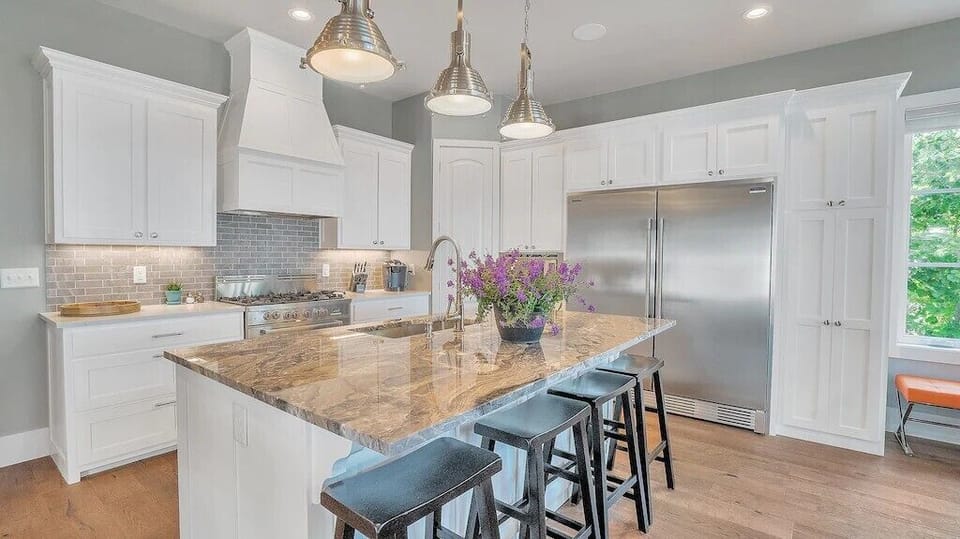 Lots of kitchen cabinets for modern-style meal prep.