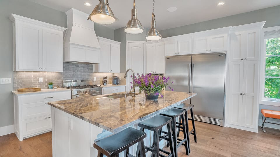 Full-sized Refridgerator and Freezer stocked with condiments