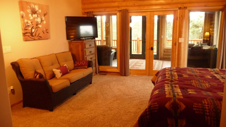 Another view of master bedroom with LCD TV.