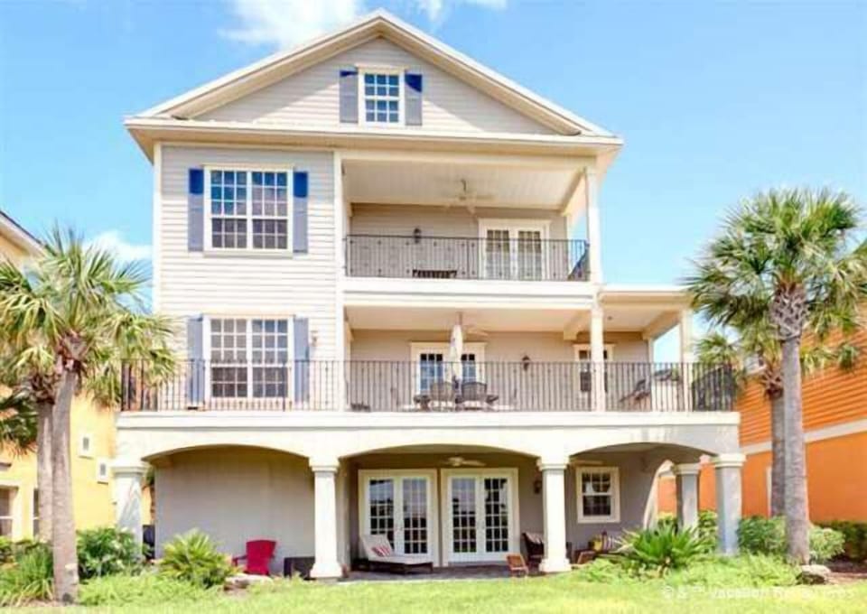 Rear of home, patios on all 3 levels facing lake
