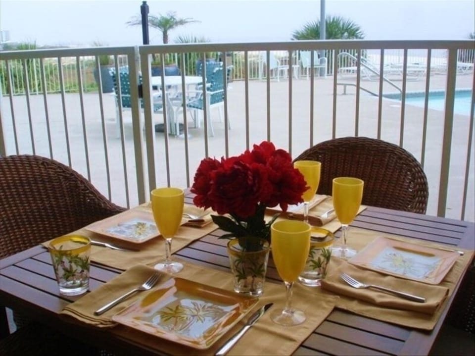 Our private patio next to pool and beach.