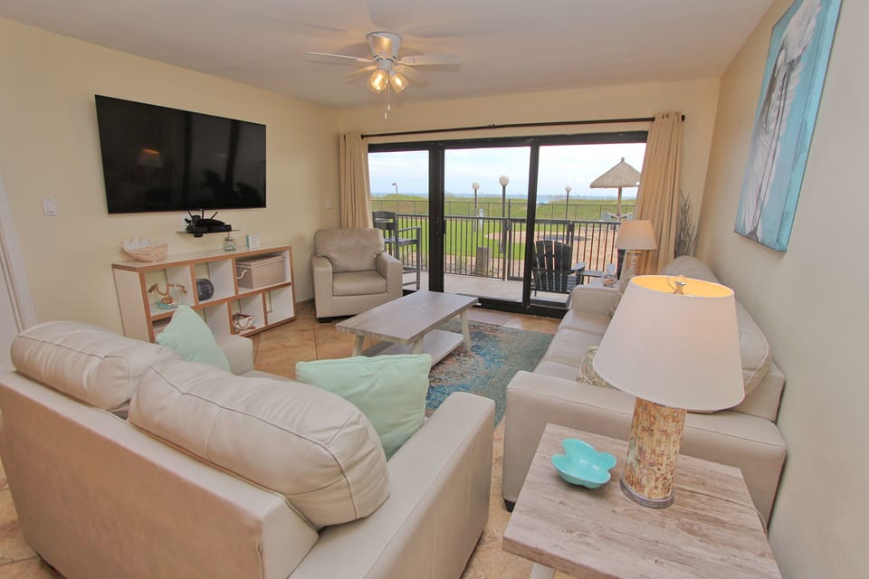 The living room features comfortable and spacious seating.
