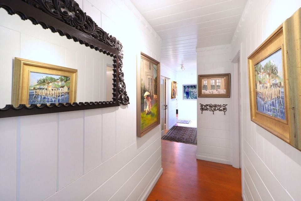 This is the view as you walk in the house although it is now carpeted with runners to make it more comfortable. The kitchen is to the left at the first junction and the bedrooms and the bathroom are down this hall. 