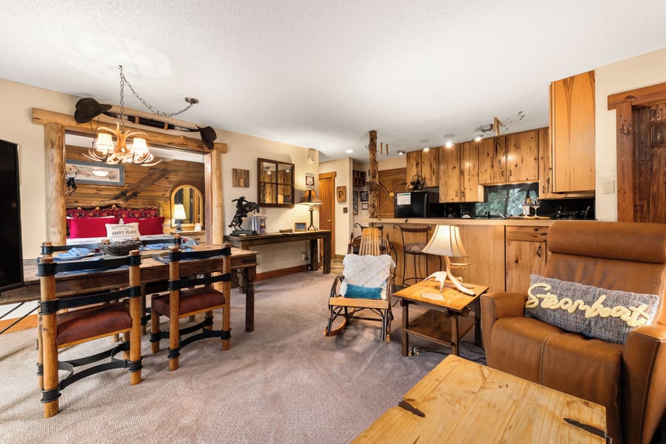 Dining table for four and two bar stools.