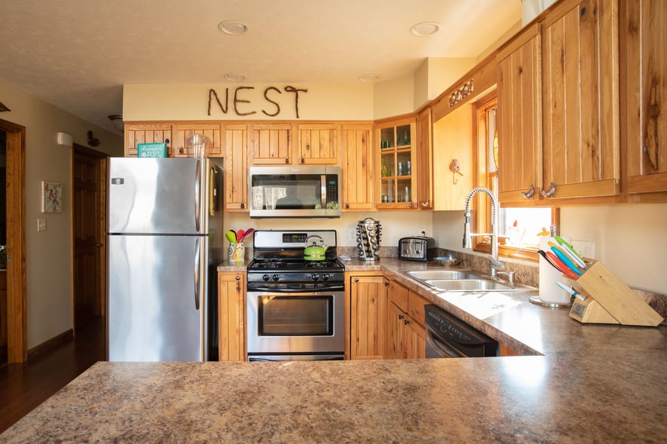 Kitchen with plenty of prep room.  gas stove, micro wave, dishwasher and fridge.