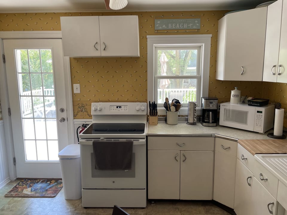 The kitchen, with a door to the back deck.