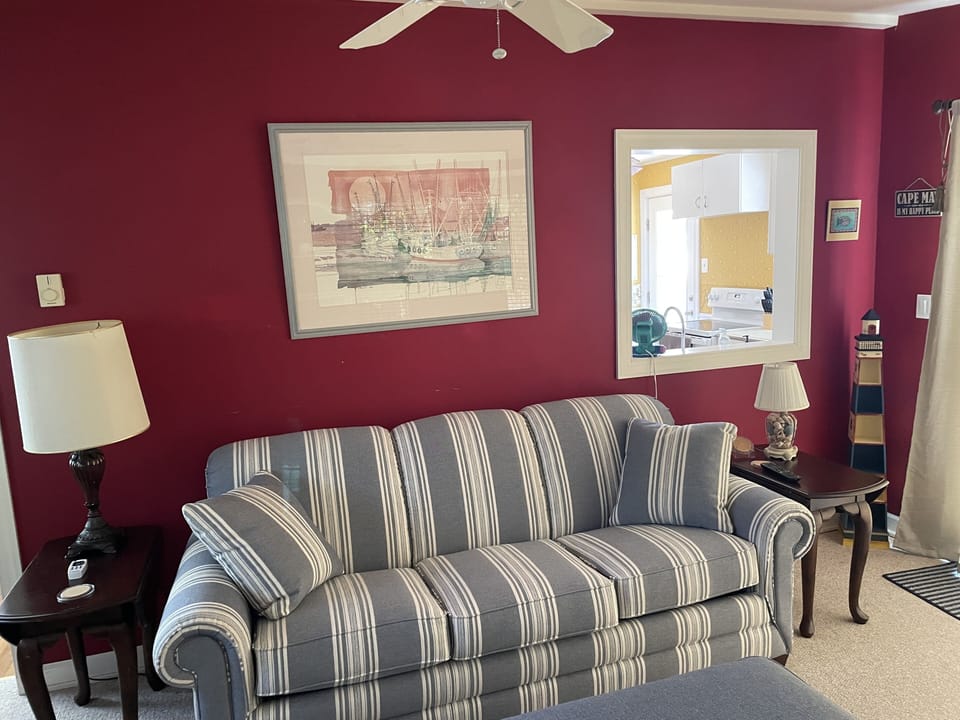 The sunroom has an open window to the kitchen.