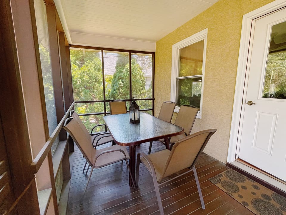 dining area on  screened mahogany front porch 