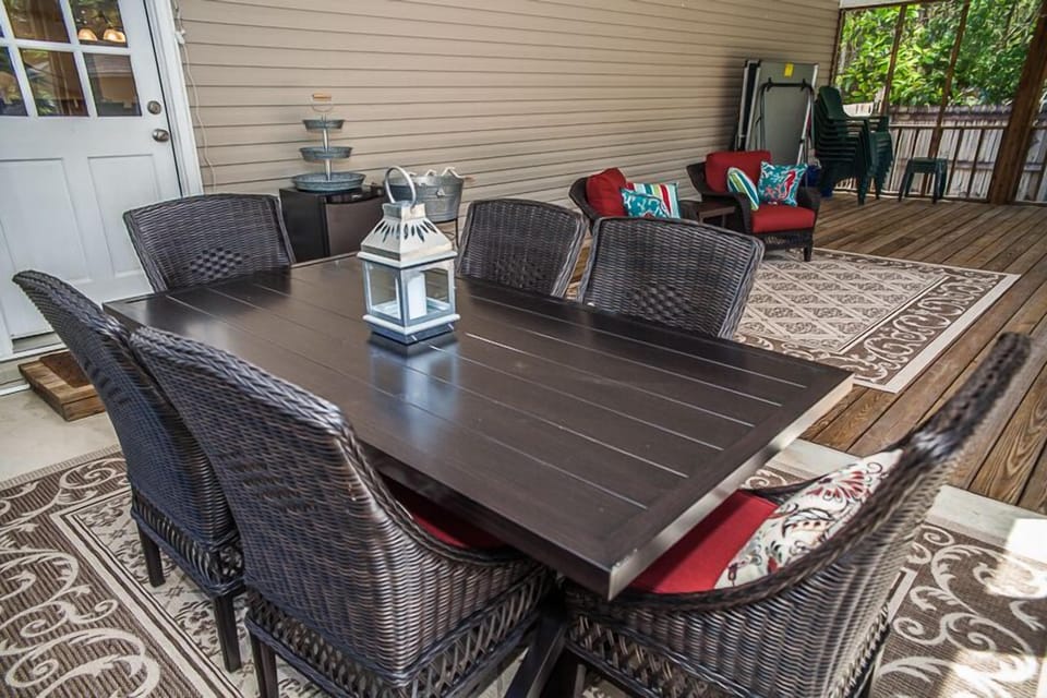 Wicker style dining seats 6 on porch. 