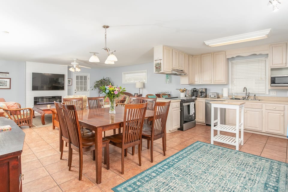 Open plan showing living room, dining area and kitchen.