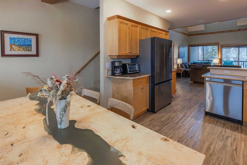 Kitchen showing stairs up to the loft. 