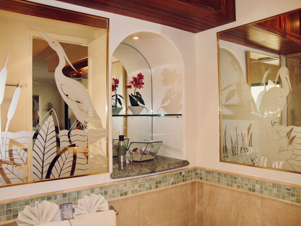 Maui Artist hand etched glass work, tile plus privacy in "water closet" area